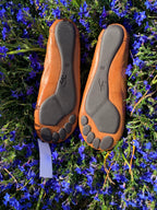 Moccasin style flats with foot print sole