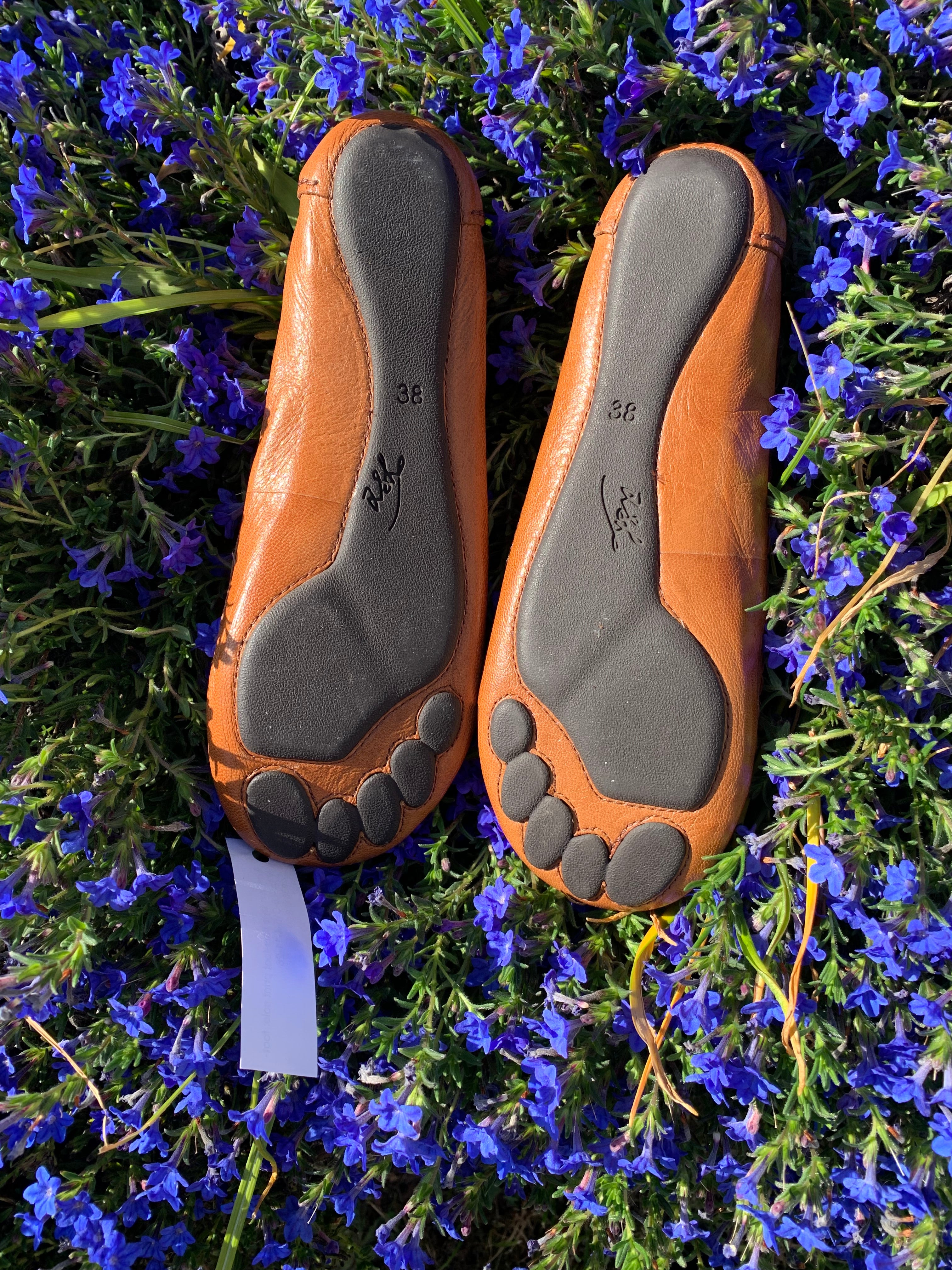 Moccasin style flats with foot print sole