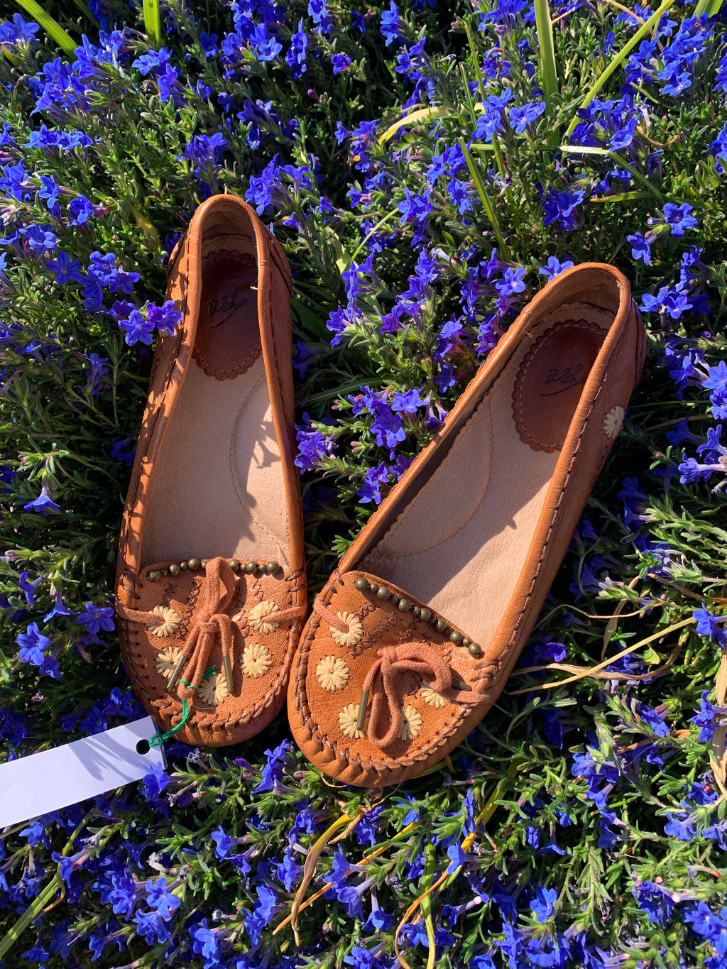 Moccasin style flats with foot print sole