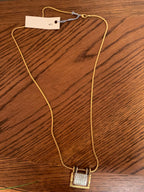 Chico’s mixed-metal "Generations of Love" folding book/locket pendant necklace.
