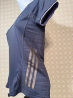 Side view of Navy blue, short sleeve, v-neck Adidas active wear women's fit top in extra small for sale by consignment.  