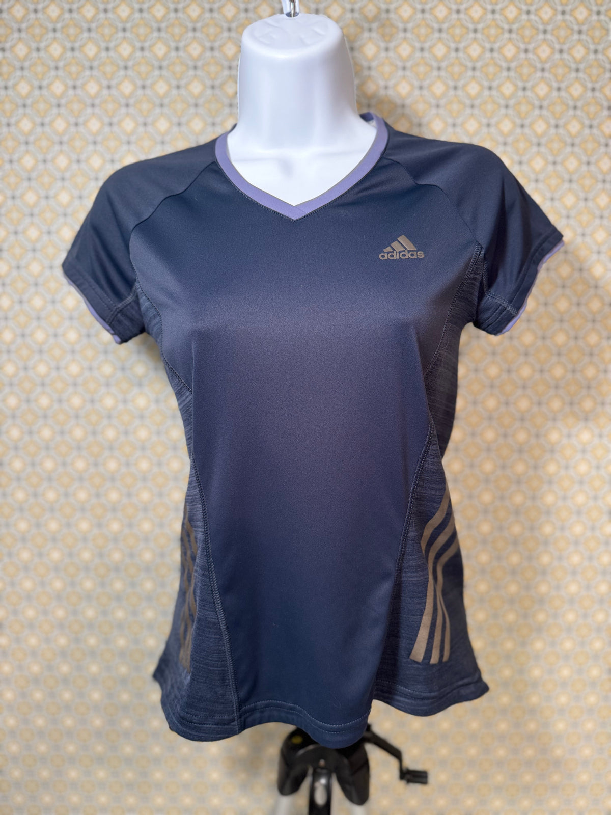 Navy blue, short sleeve, v-neck Adidas active wear women's fit top in extra small for sale by consignment.  