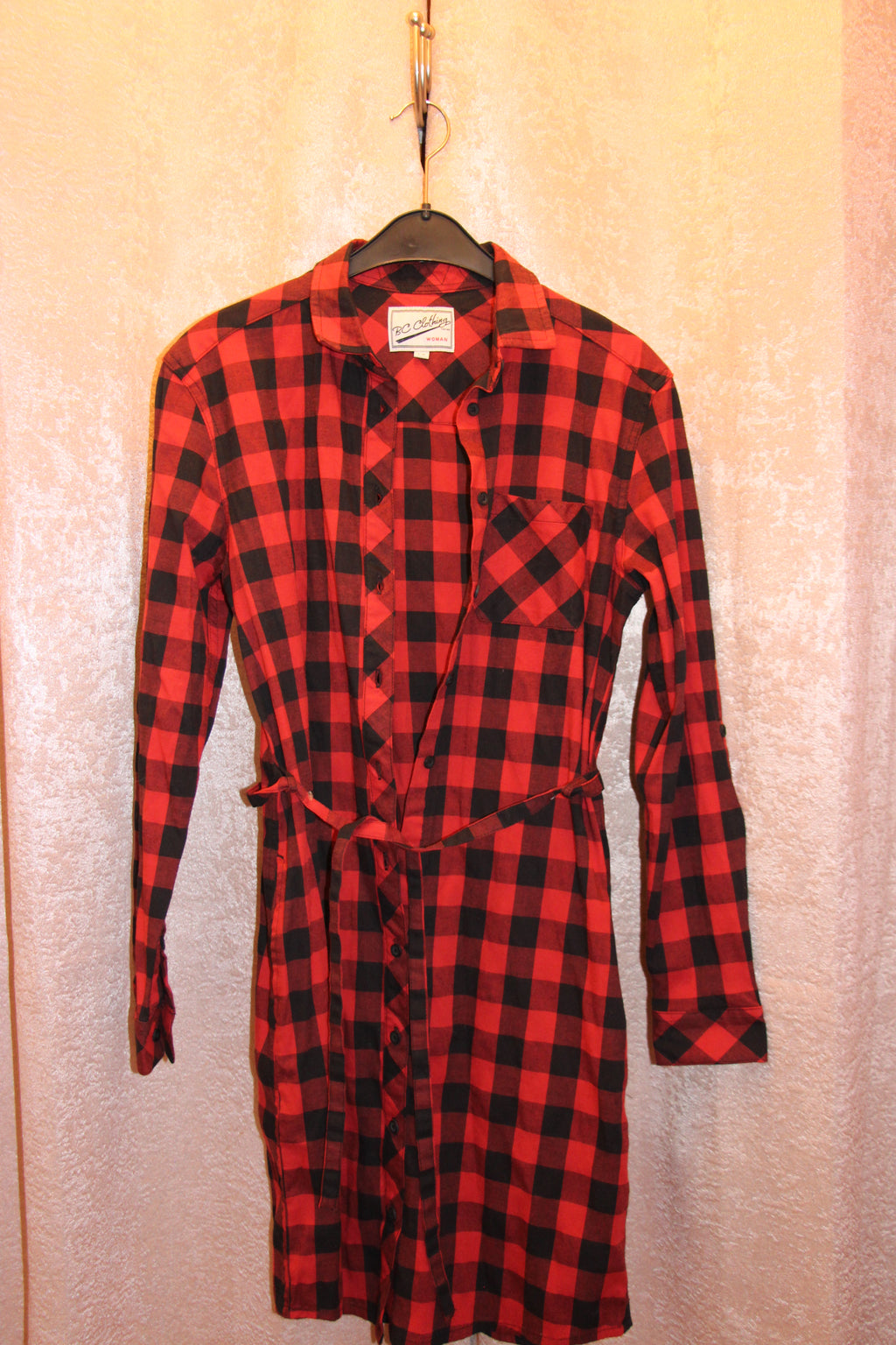A red and black buffalo plaid long-sleeve cotton blend shirt dress for sale on consignment.