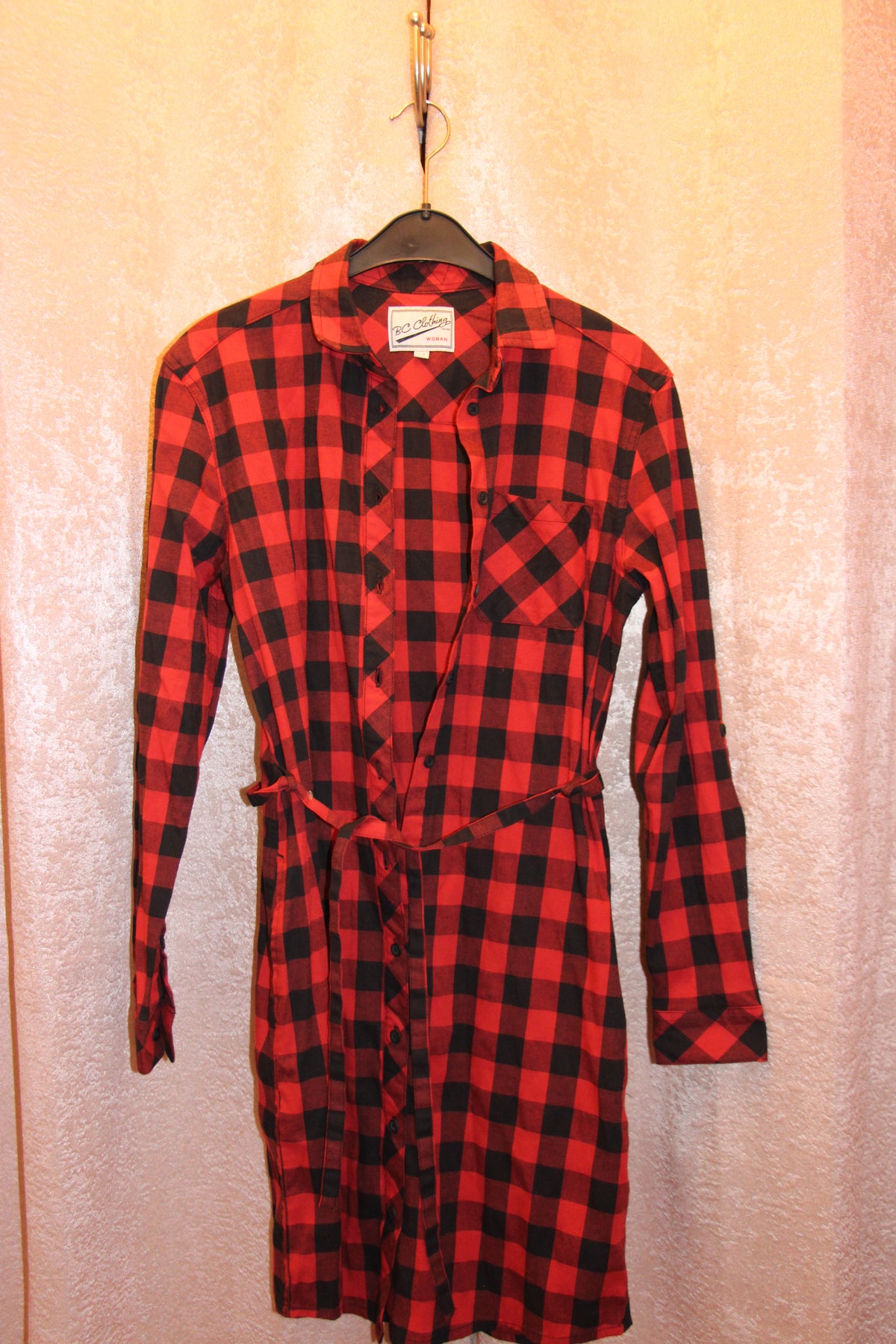 A red and black buffalo plaid long-sleeve cotton blend shirt dress for sale on consignment.