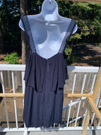 Sleeveless navy blue dress with flowy skirted bust by Maeve