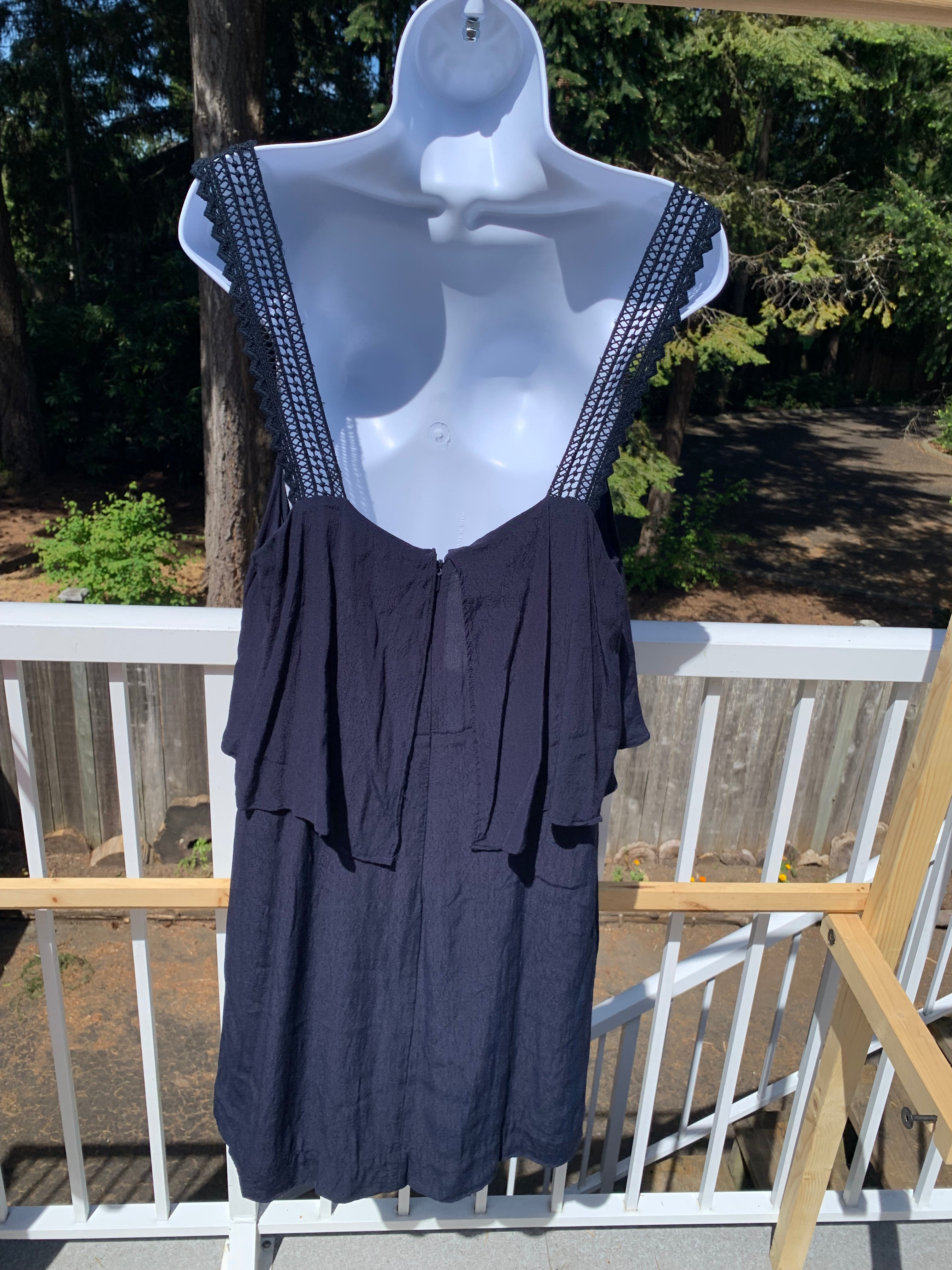 Sleeveless navy blue dress with flowy skirted bust by Maeve