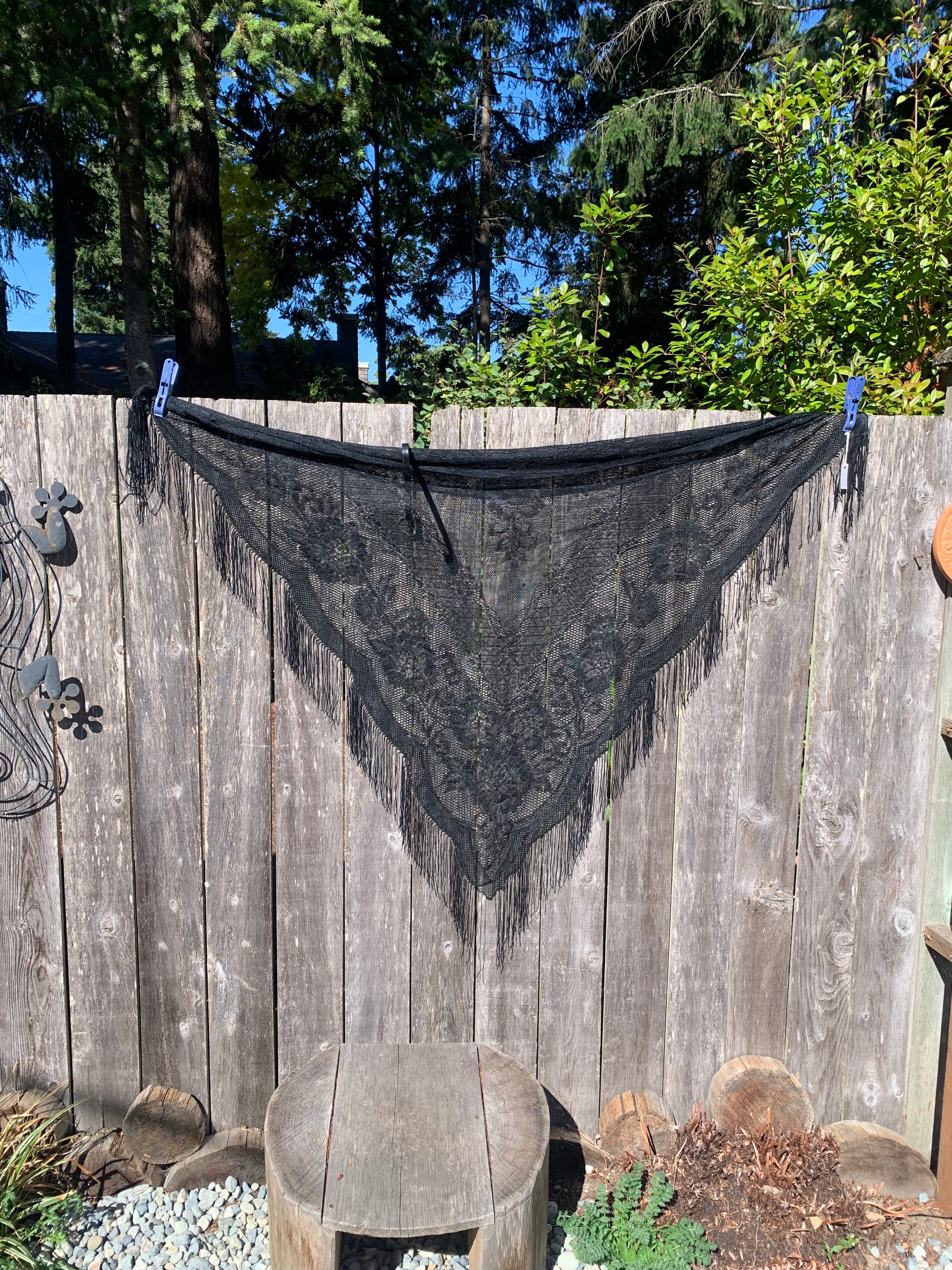 A black lace and fringe triangular shawl or scarf for sale at Vardo Vintage and Valuables consignment online shop. 