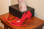 Size 9 Red high heel pumps with ankle tie by ShoeDazzle