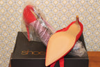 Size 9 Red high heel pumps with ankle tie by ShoeDazzle