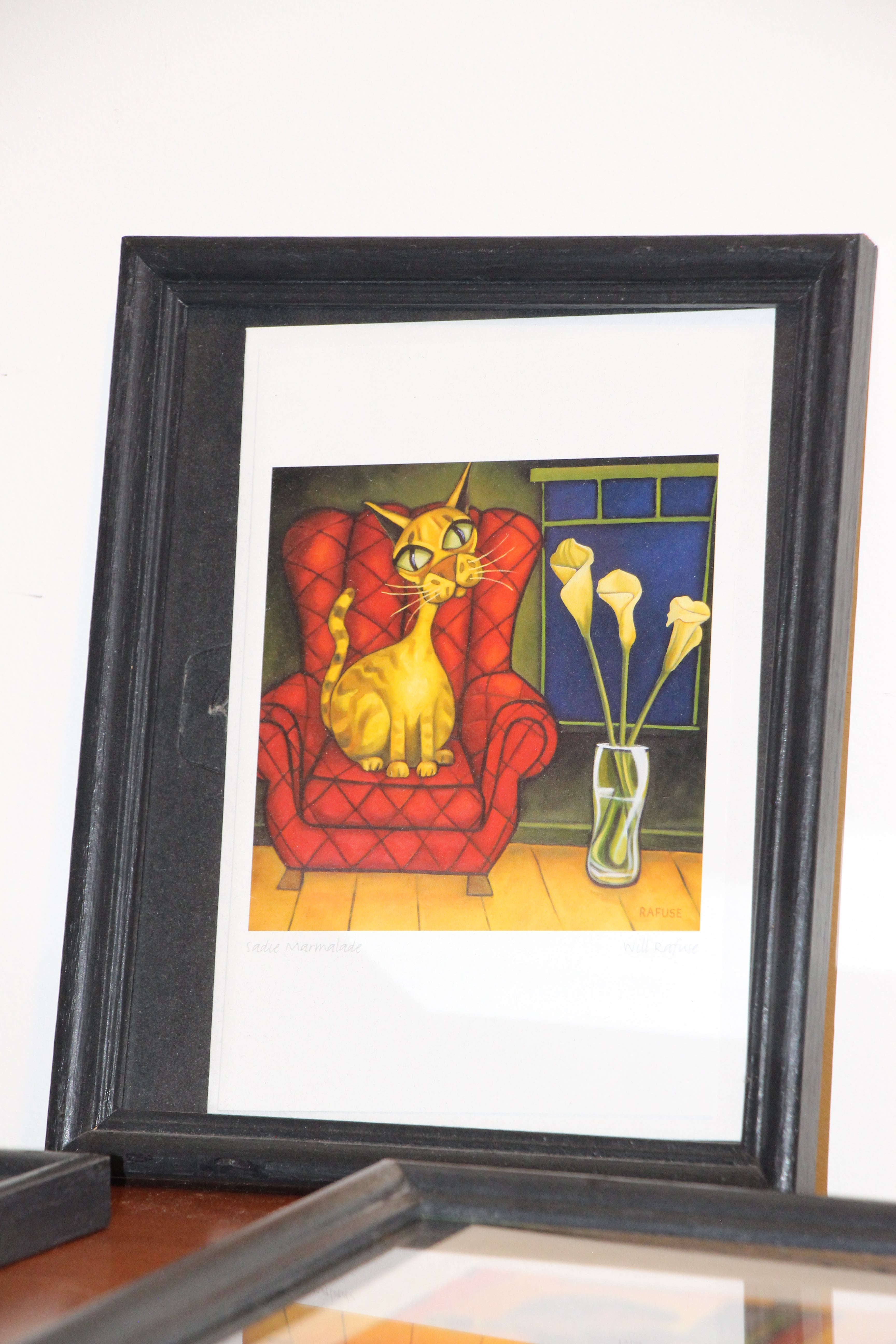 3 Will Rafuse prints in black wood frames