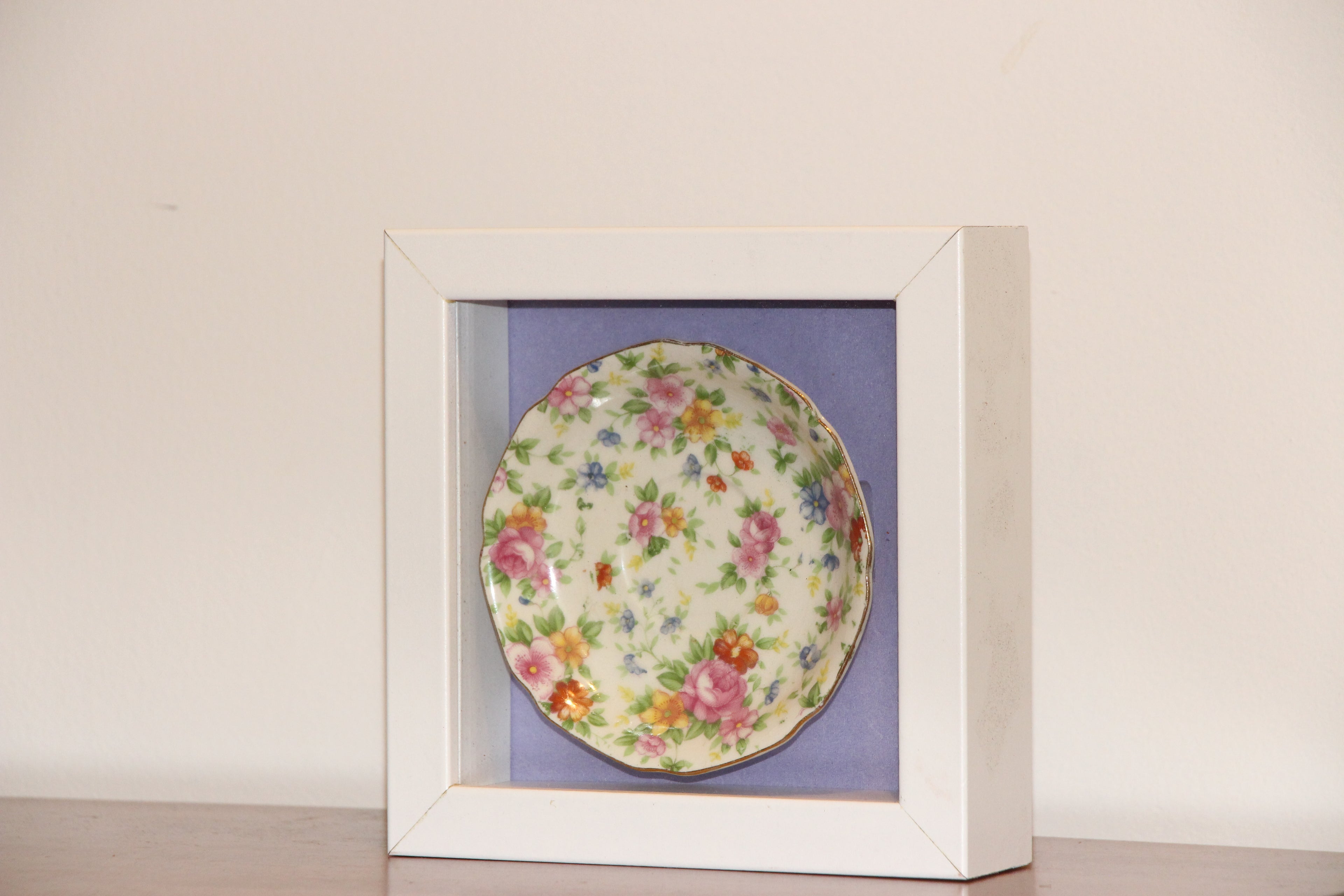 China dish in shadow box frame