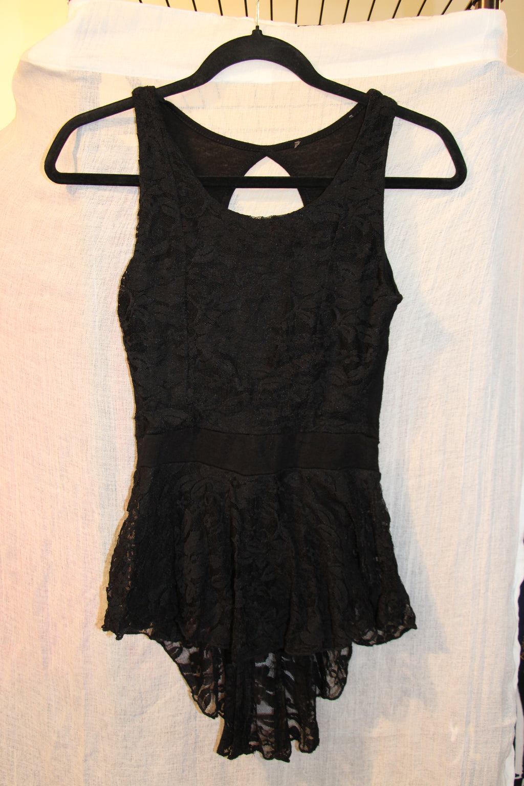 Lined Black Lace Sleeveless Top With Cut Out Back And High-Low Skirted Waist Hem
