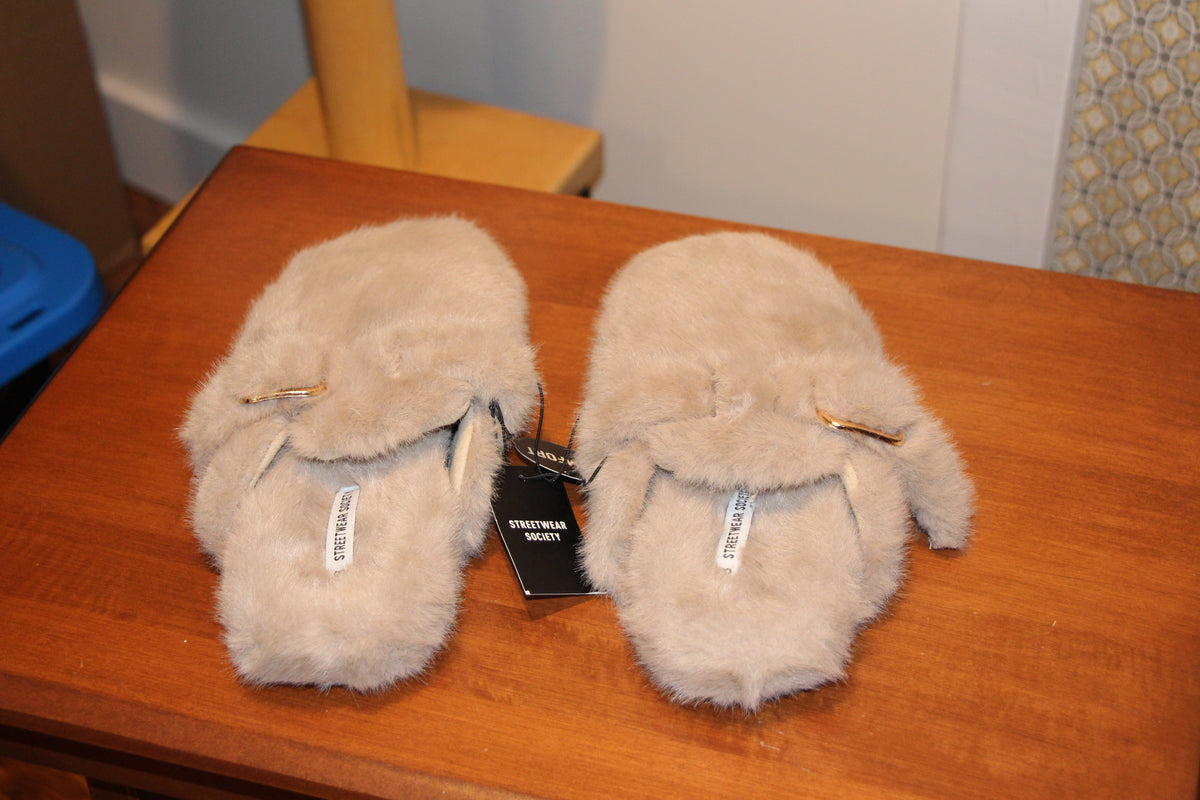 A pair of fluffy beige faux-fur slip-on slippers with small gold-tone buckle by Streetwear Society  in Size 8