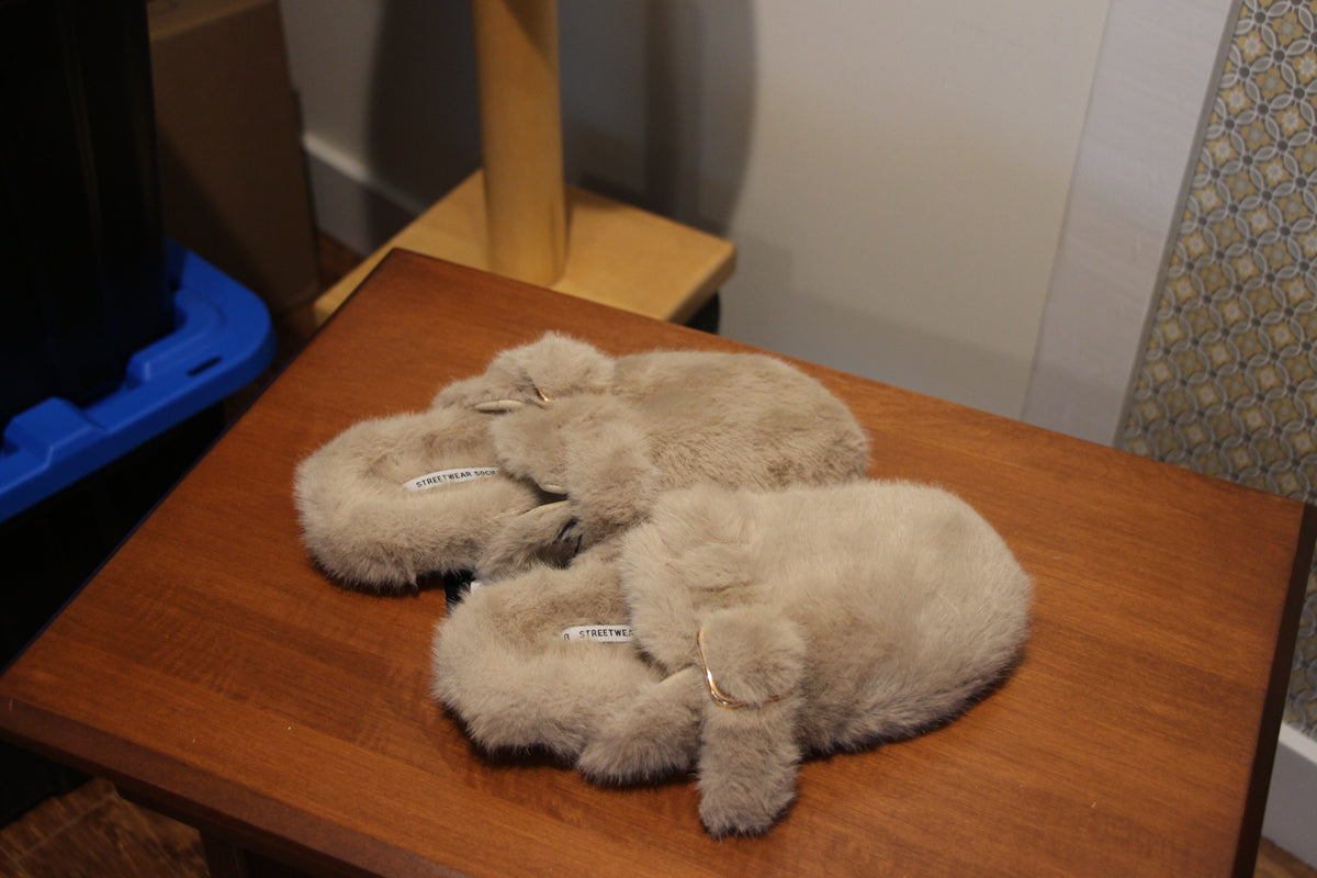 A pair of fluffy beige faux-fur slip-on slippers with small gold-tone buckle by Streetwear Society  in Size 8