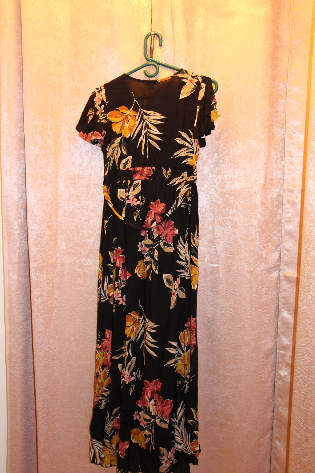 A consignment boutique black maxi dress with a vibrant floral print in pink, yellow, and orange, NWT Size S Patrons of Peace Black Floral Short Sleeve Maxi Dress.