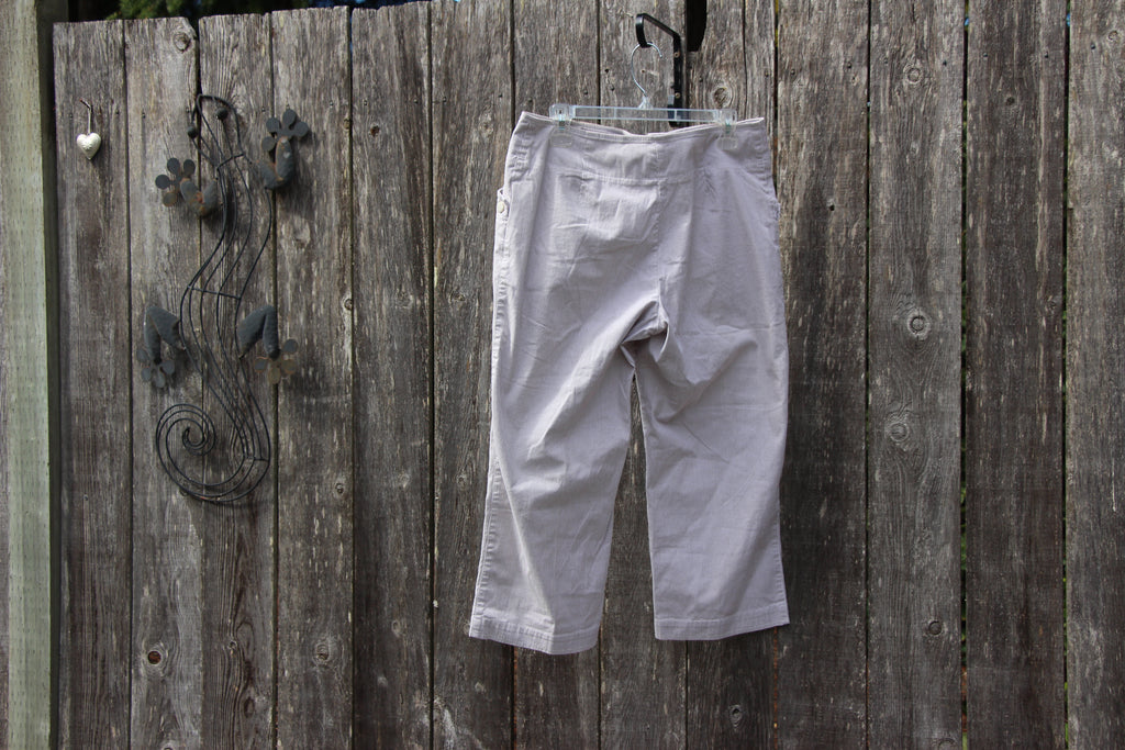 A pair of light gray striped cropped pants  by Haggar- Vertical Striped Cotton Pants Size 12