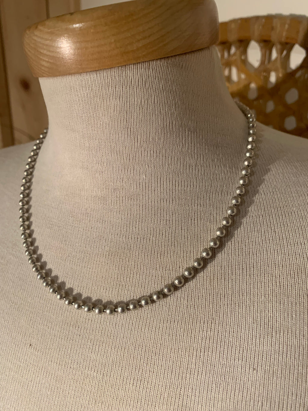 single-strand silver tone metal bead necklace, a Southwestern-inspired classic featuring smooth, high-polish spherical beads