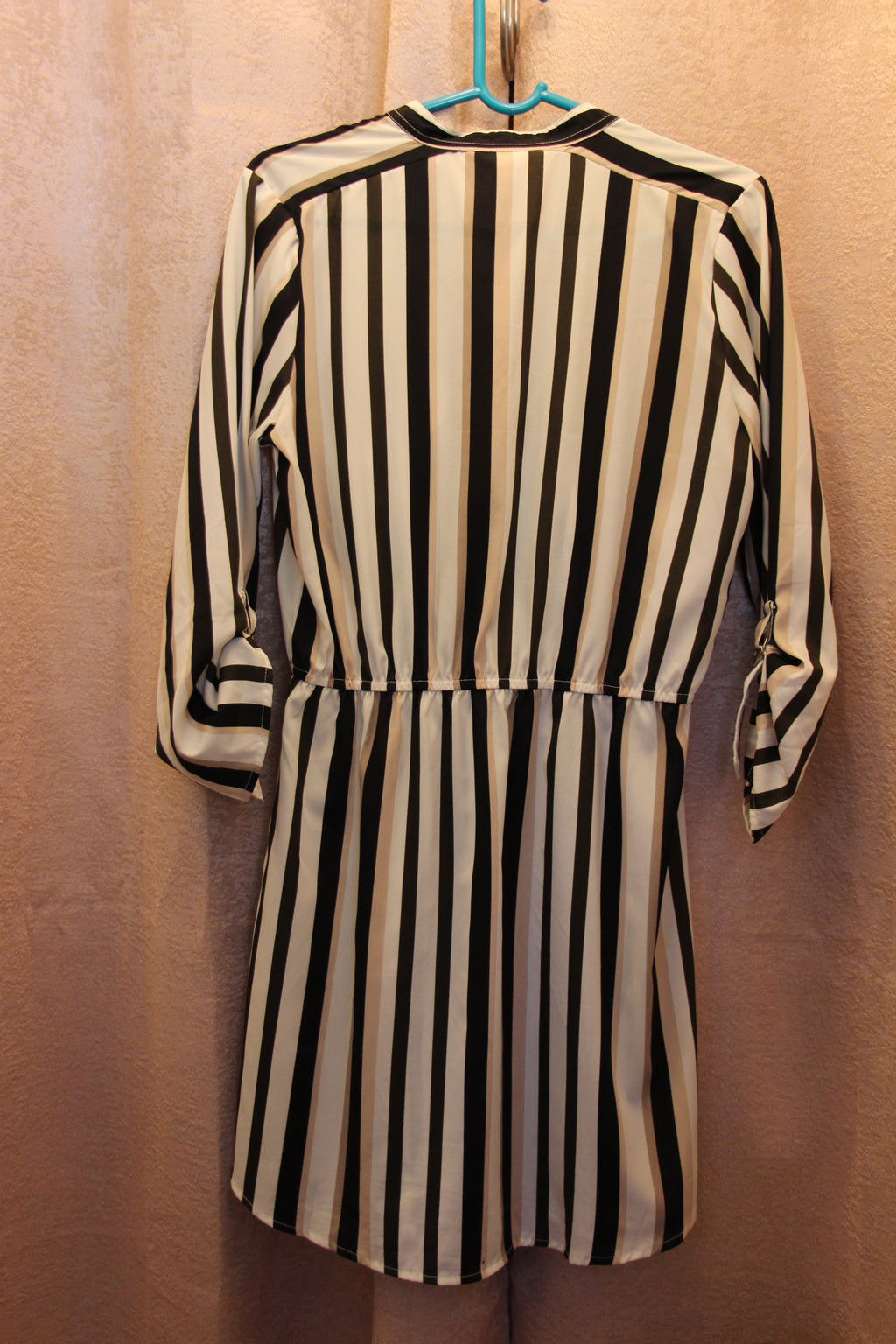 Back view of dress for sale via consignment. It is a size medium Beige/Black/Cream Vertical Striped Dress by Streetwear Society.