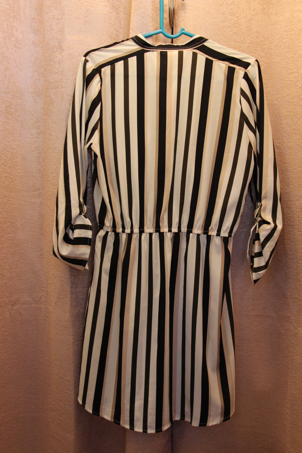 Back view of dress for sale via consignment. It is a size medium Beige/Black/Cream Vertical Striped Dress by Streetwear Society.