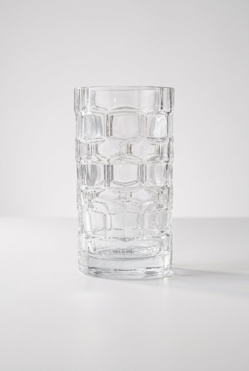 A clear textured vase with a geometric, raised-grid pattern on consignment. 