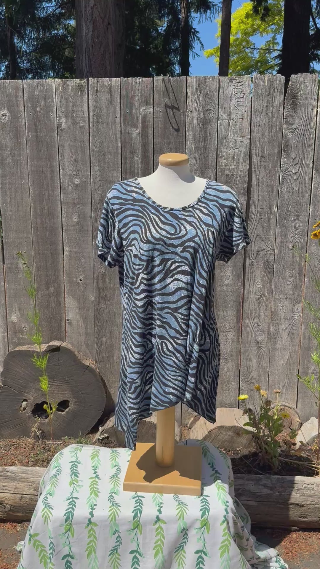 short video of a rayon multi colour print top blowing in the wind. 