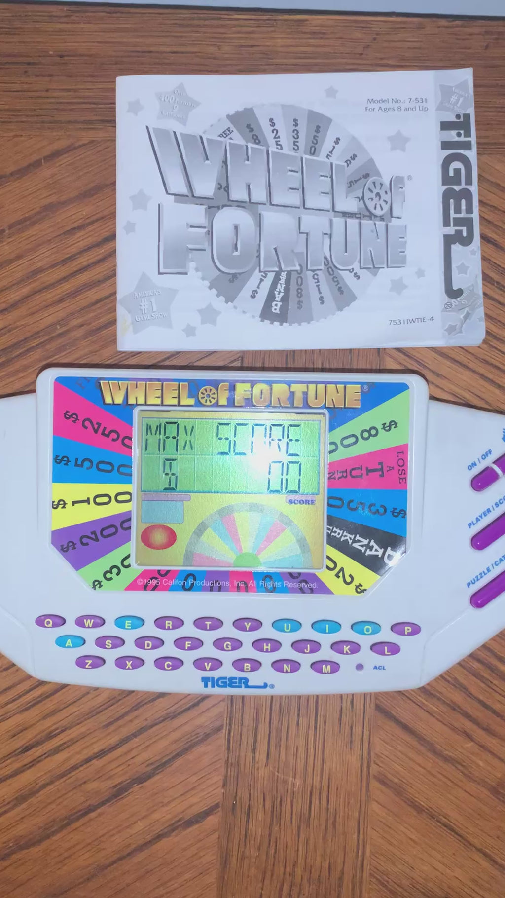Wheel Fortune Handheld Game by Tiger