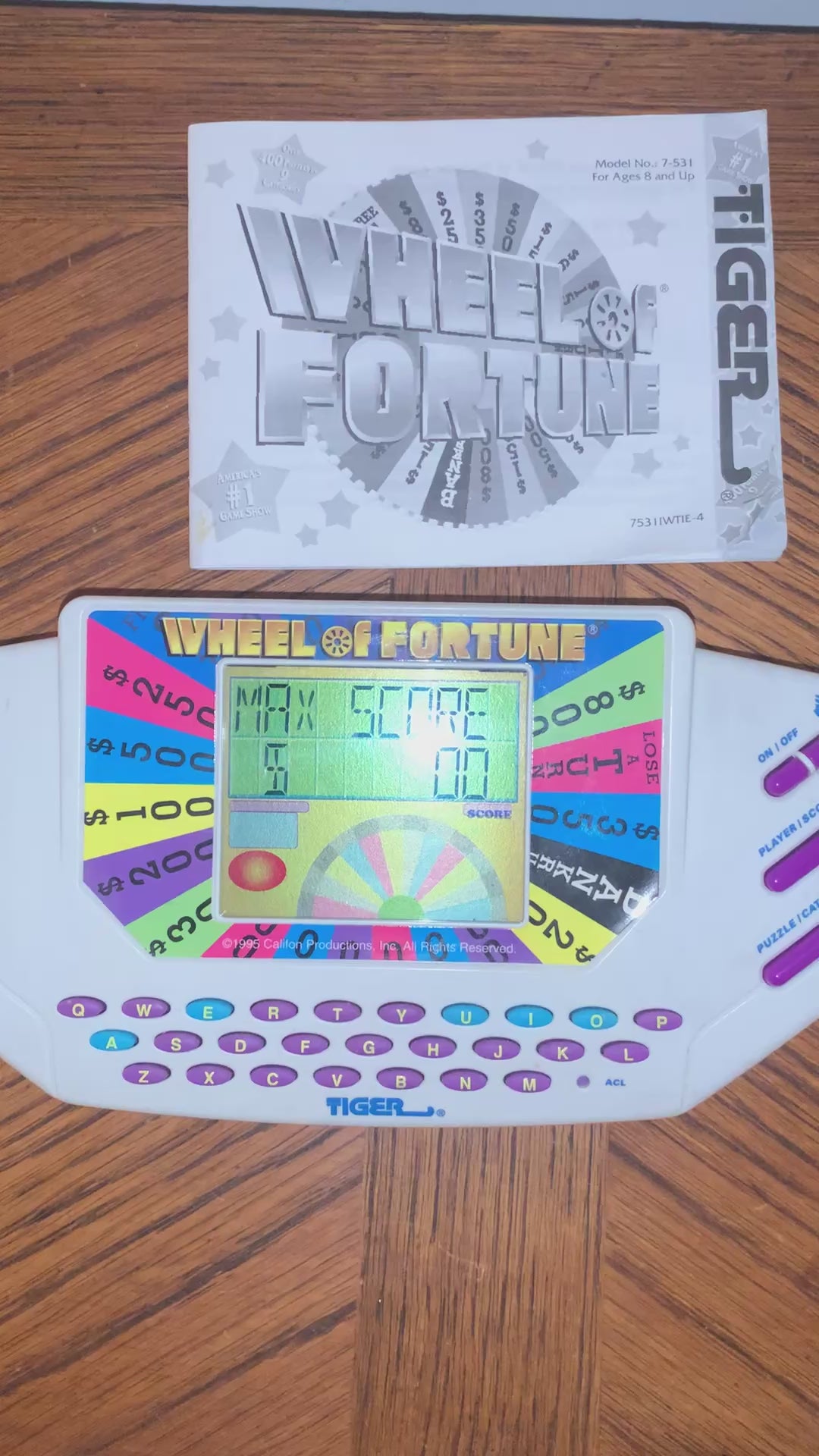 Wheel Fortune Handheld Game by Tiger