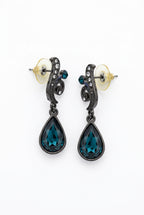 vintage-inspired teardrop dangle earrings, featuring dark gunmetal or antiqued silver-tone metal and faceted deep-toned teardrop stones