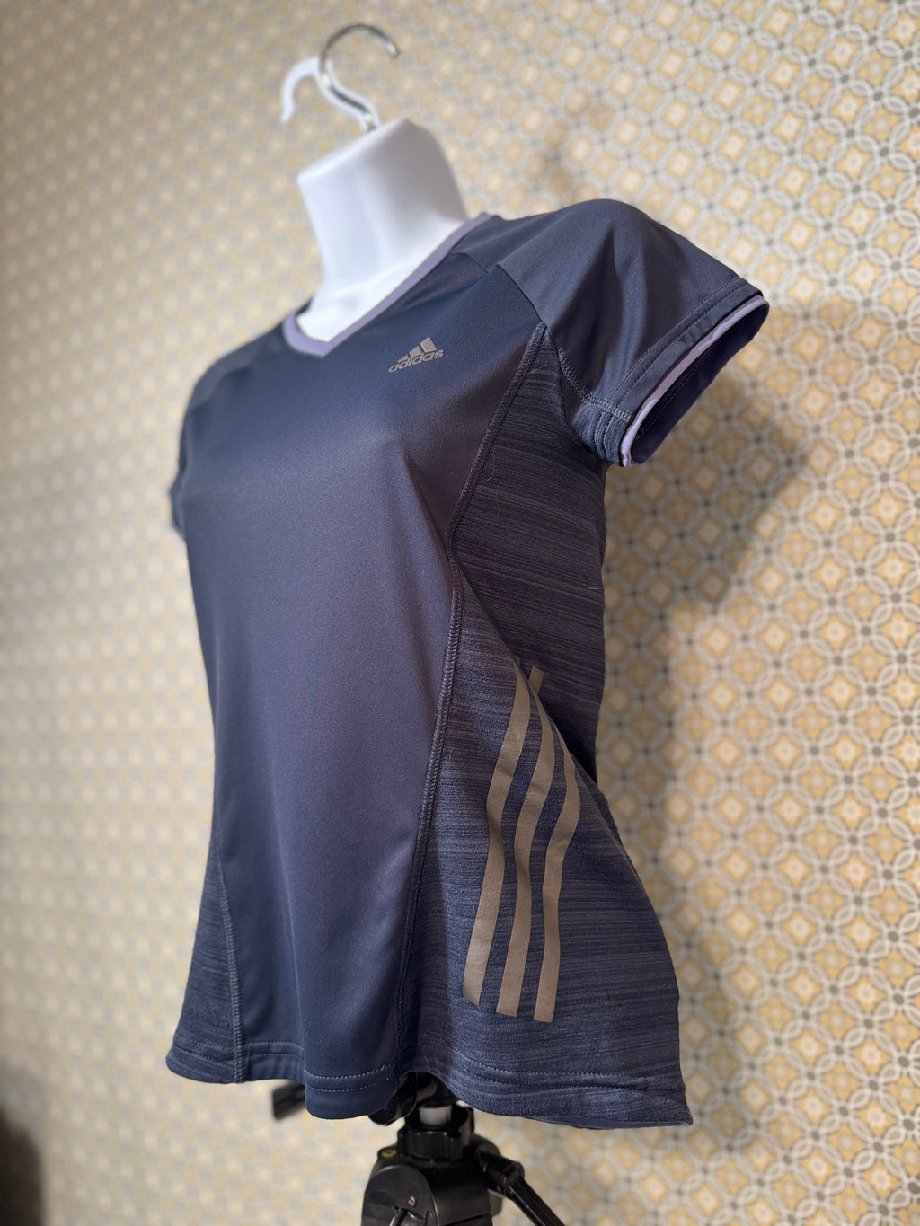 Navy blue, short sleeve, v-neck Adidas active wear women's fit top in extra small for sale by consignment.  